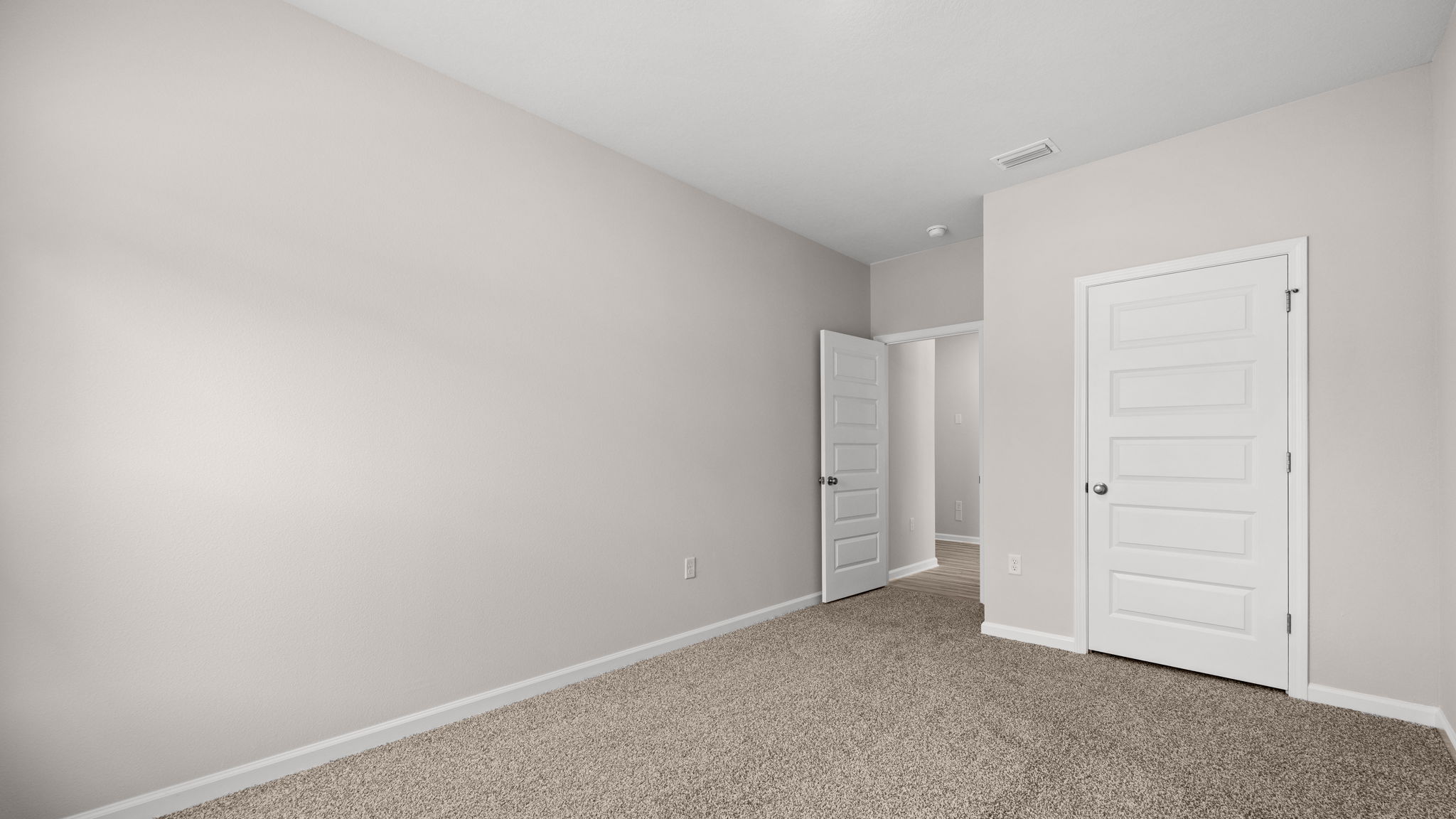 Bedroom with carpet floor and closet.