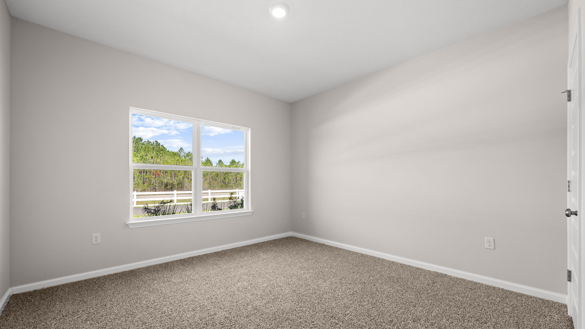 Bedroom with carpet floor and window and closet.