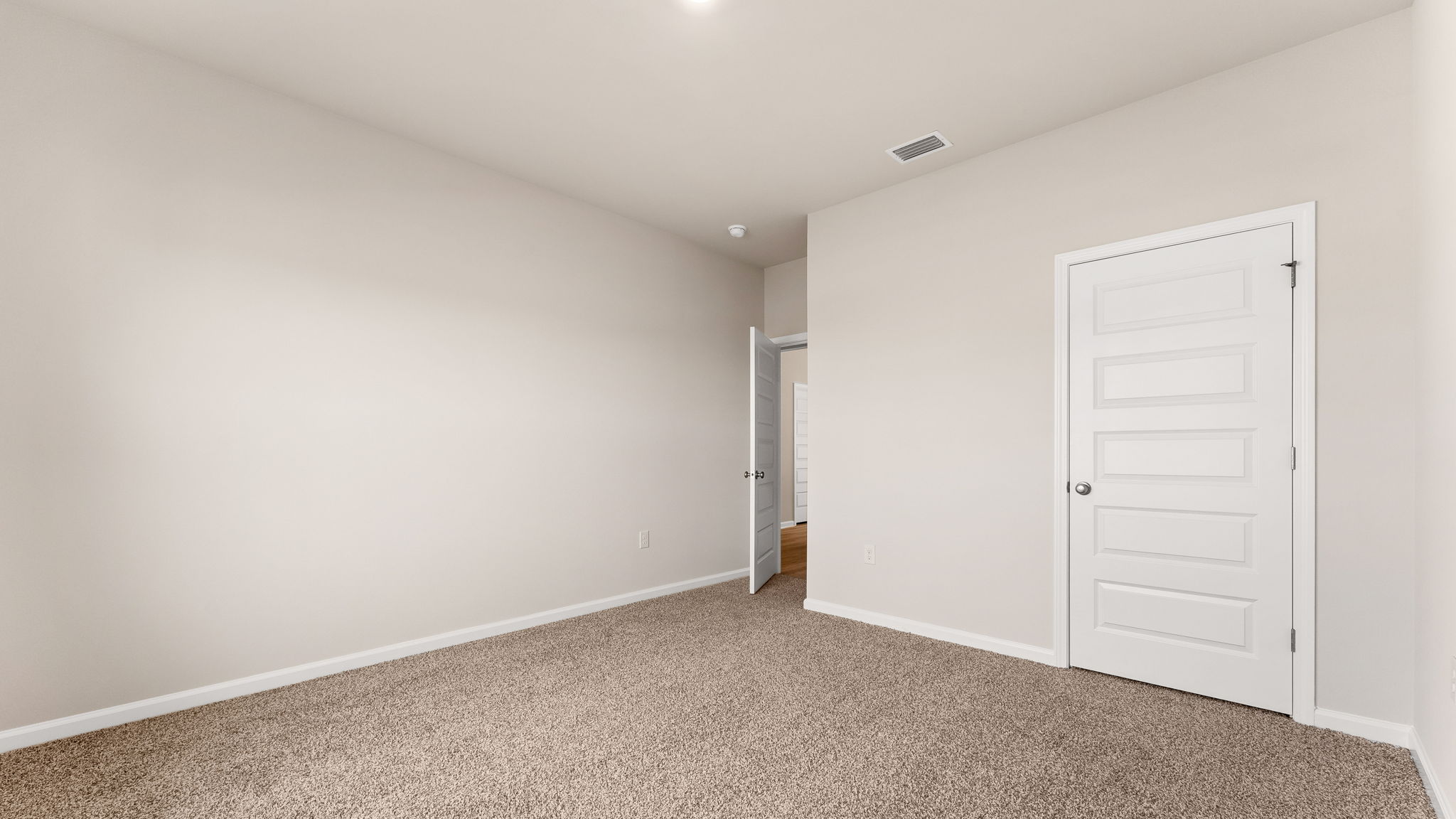 Bedroom with carpet floor and closet.