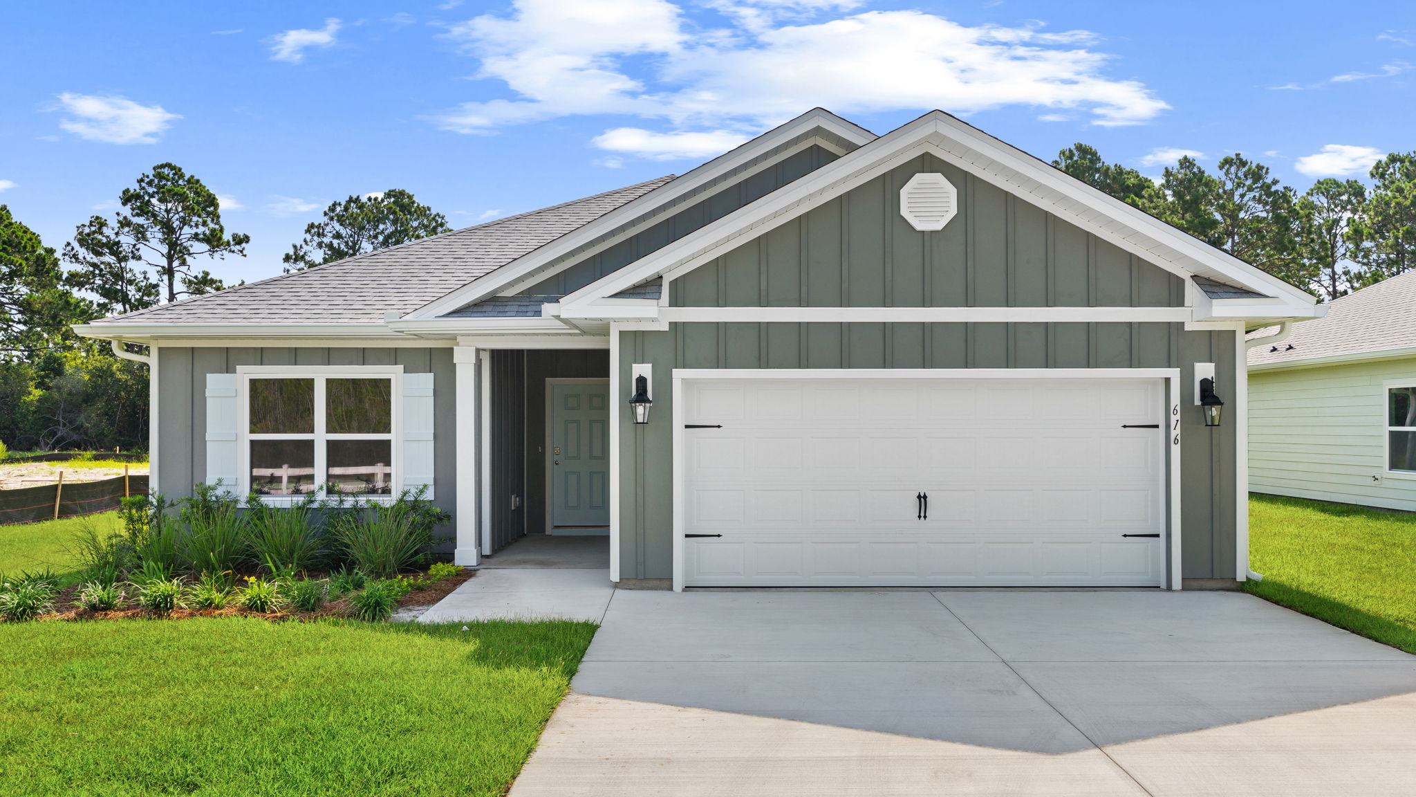 Walker plan at Buffer Farms front of home with Hardie siding and two car garage.