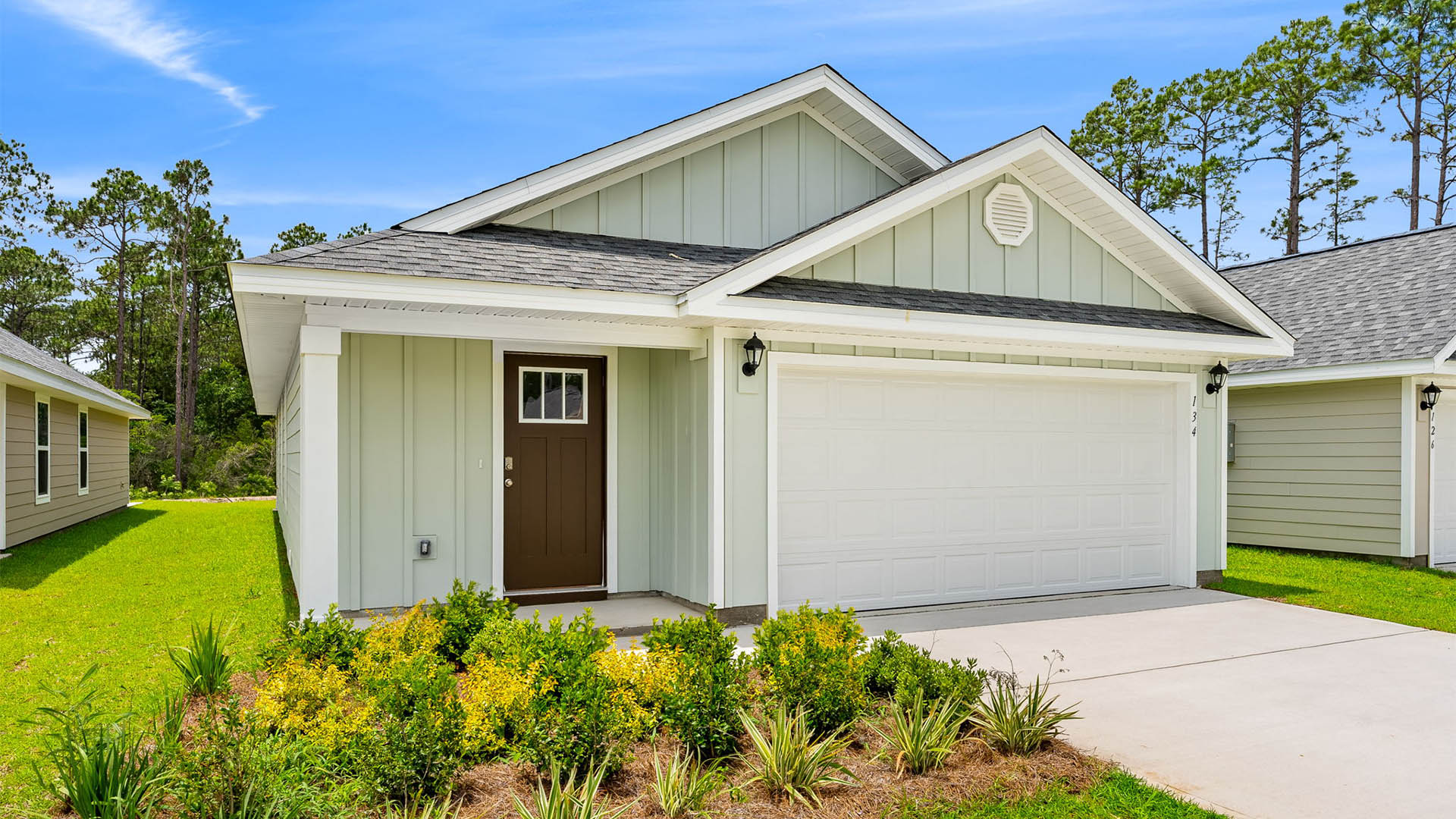Burke plan with vinyl siding and two-car garage.