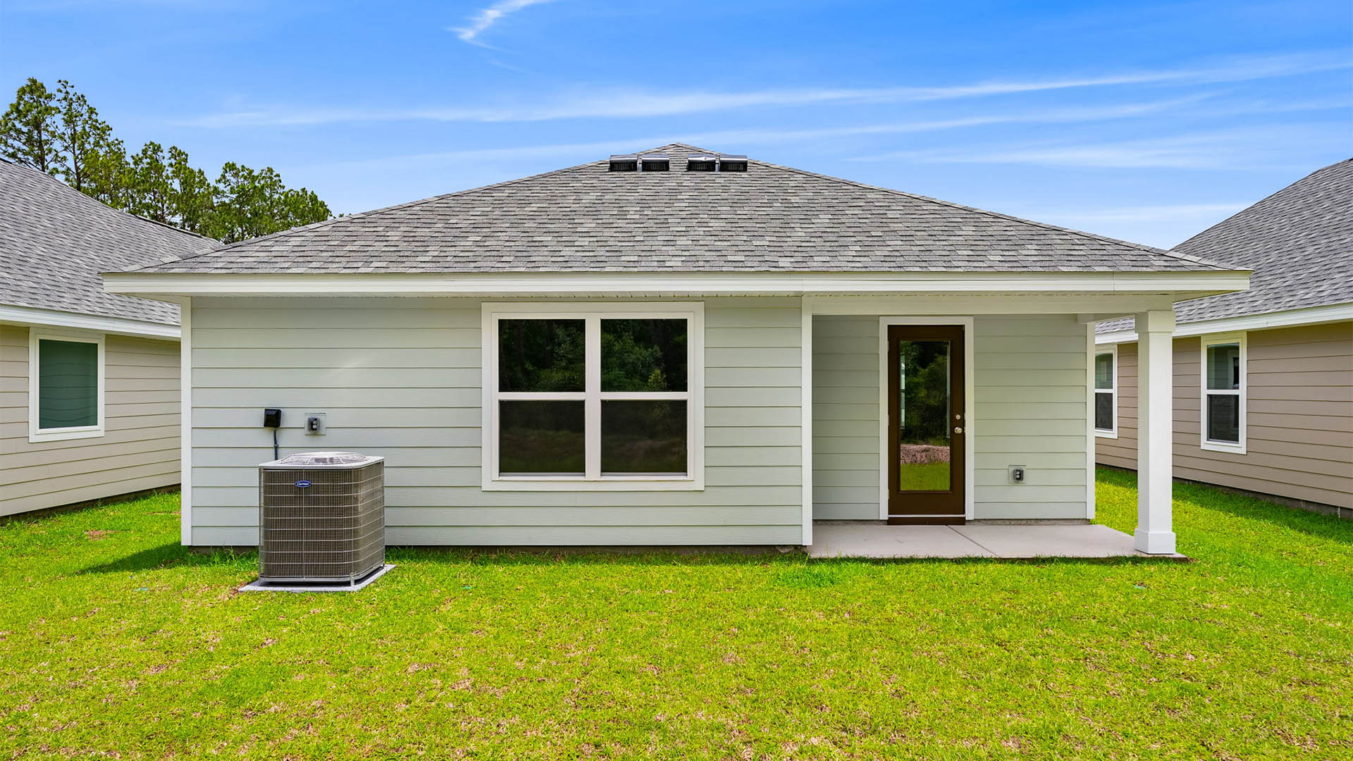 Burke plan rear of home with covered rear patio.
