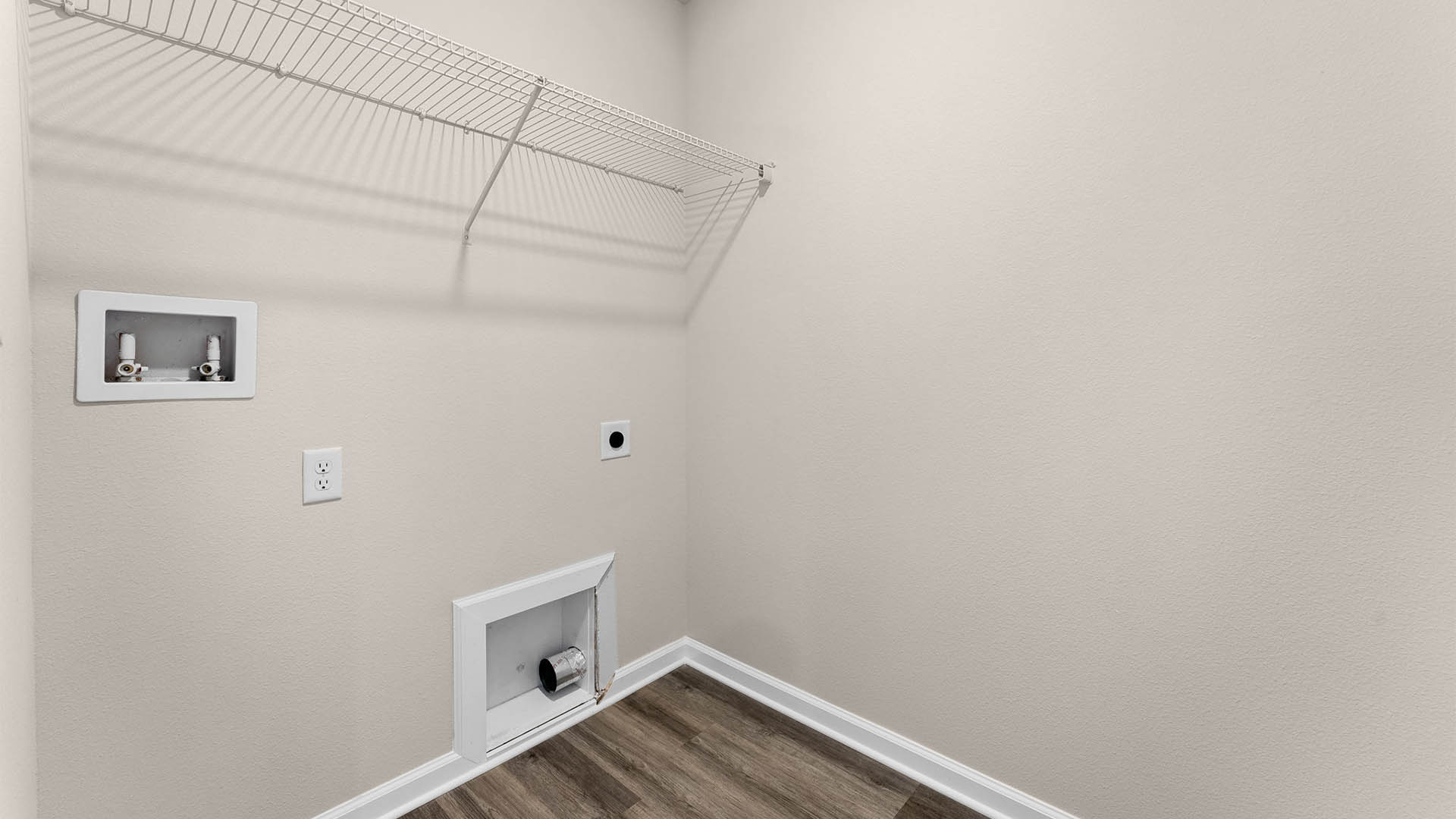 Laundry room with EVP flooring and ventilated shelving.