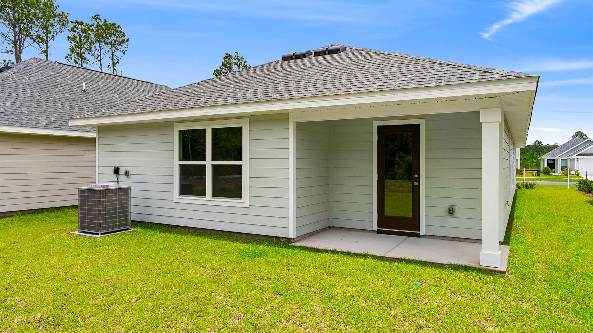 Burke plan rear of home with covered rear patio.