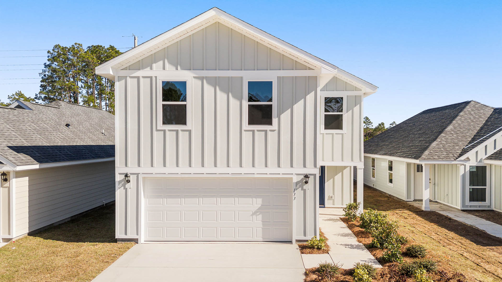 Aisle plan with Hardie siding and covered front walkway and two-car garage.
