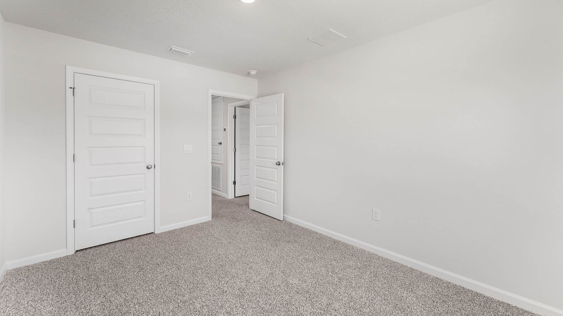 Bedroom with carpet floor and closet.