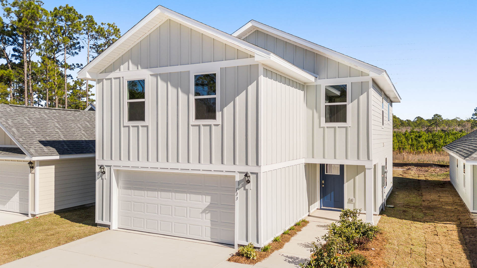 Aisle plan with Hardie siding and covered front walkway and two-car garage.