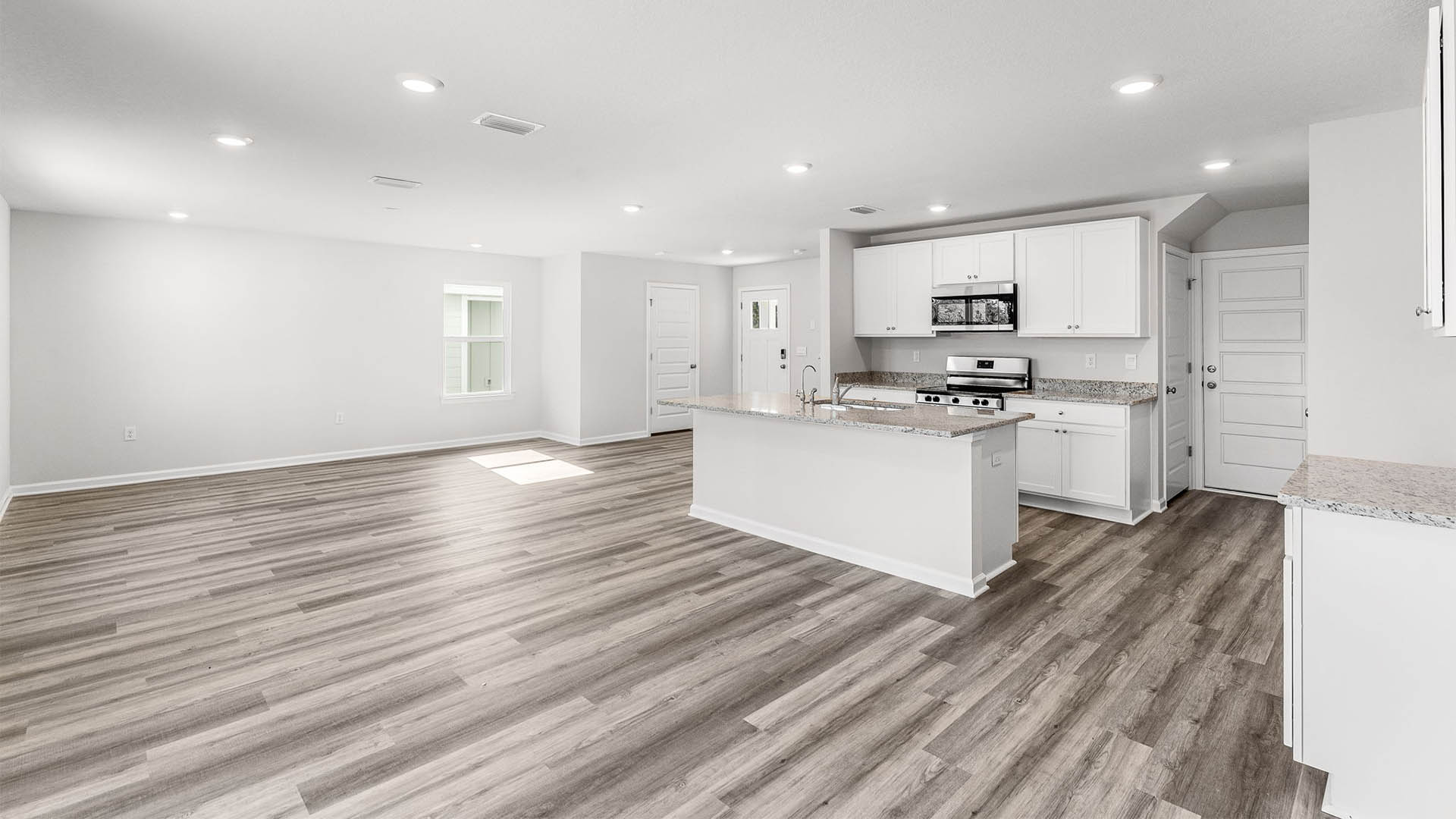Open living room, kitchen, and dining area.