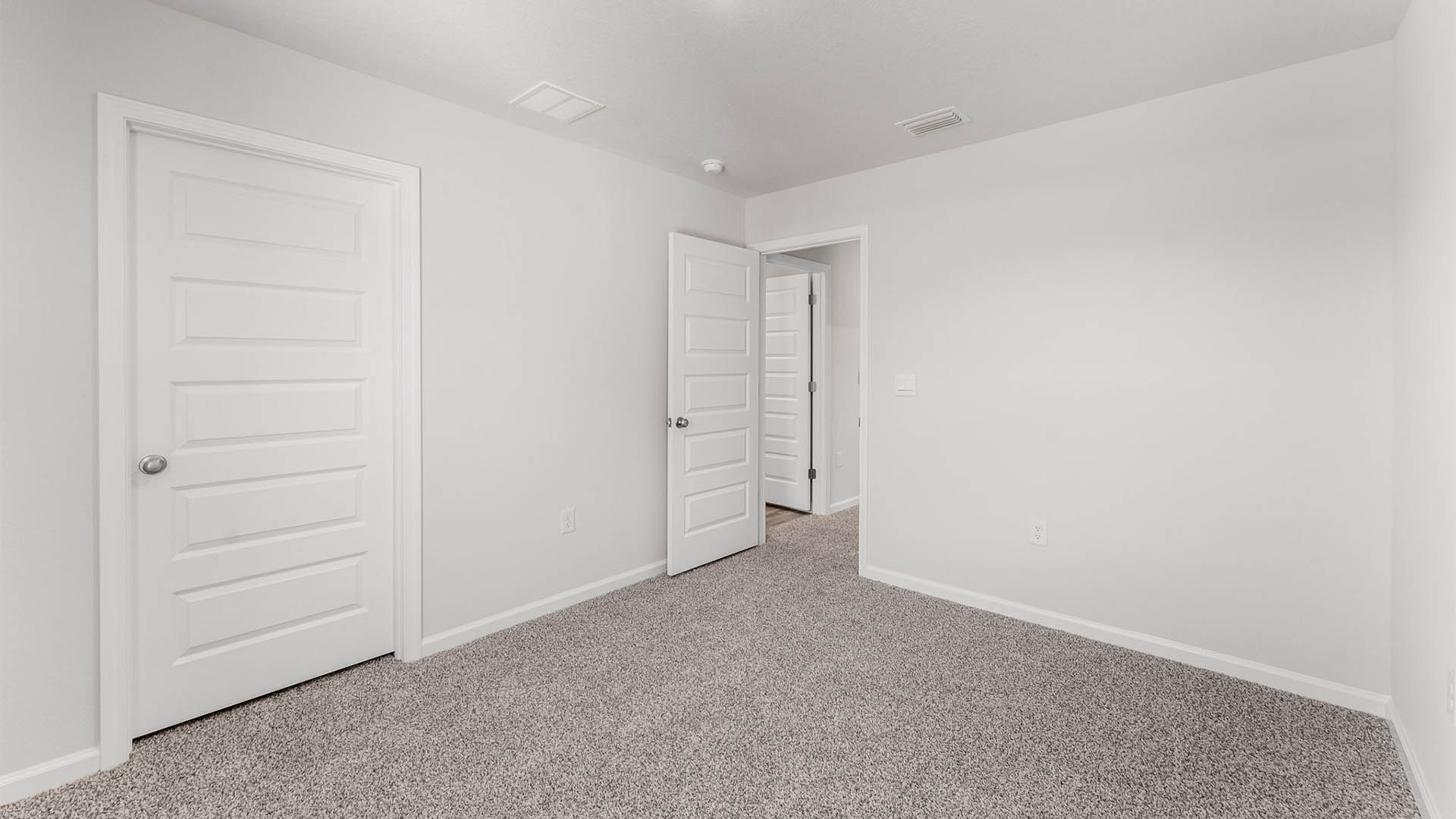 Bedroom with carpet floor and closet.