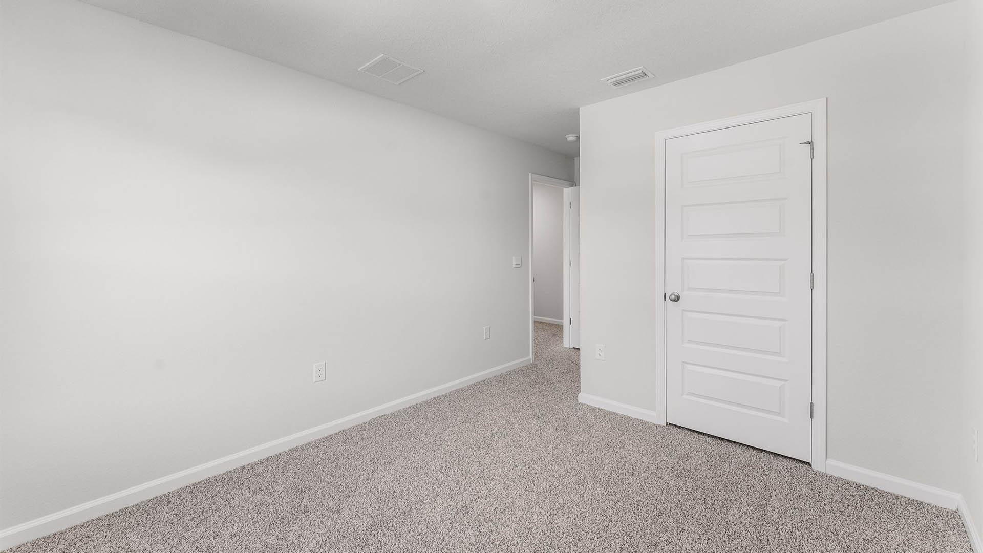 Bedroom with carpet floor and closet.