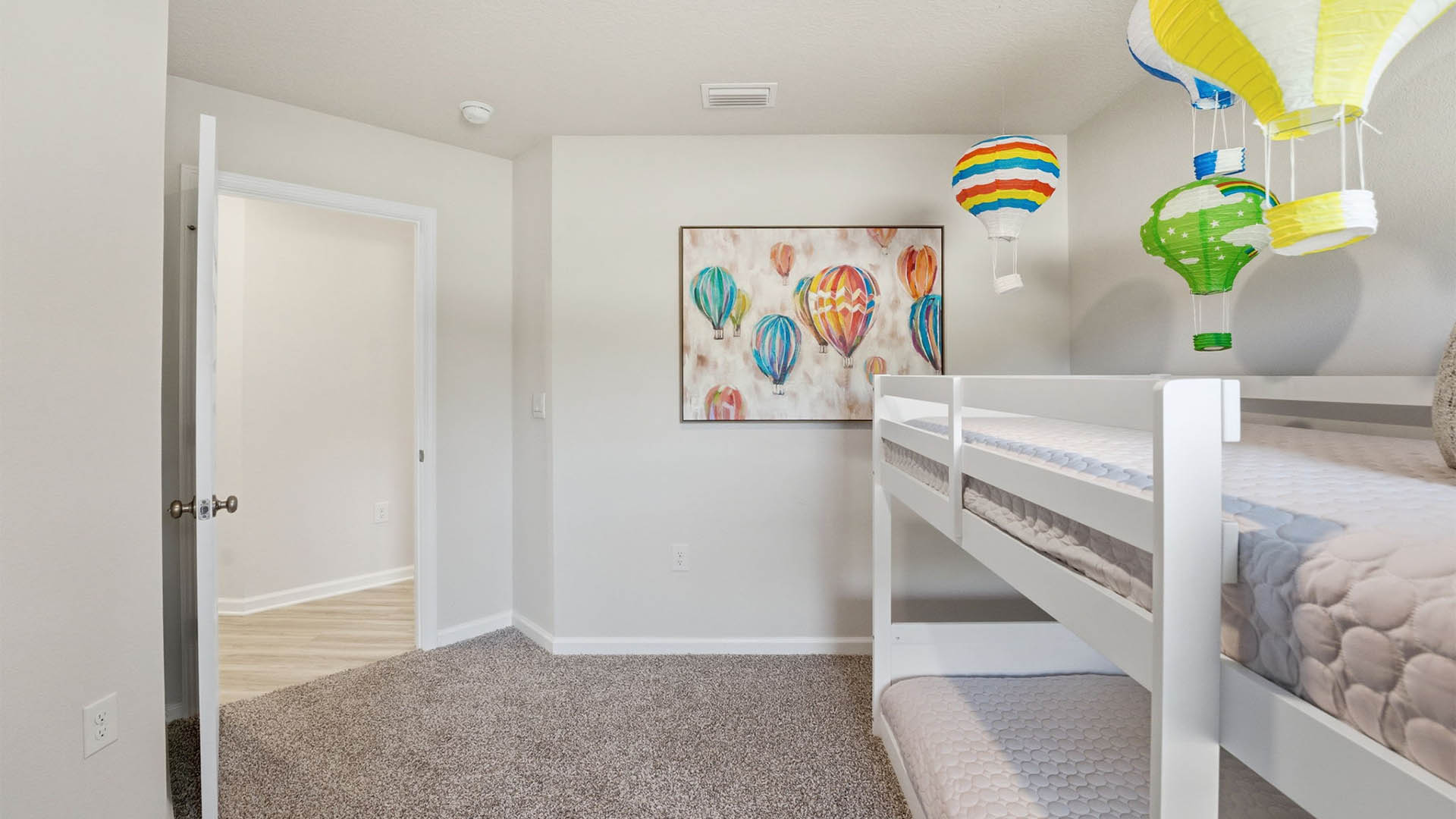 Bedroom with closet and carpet floors.