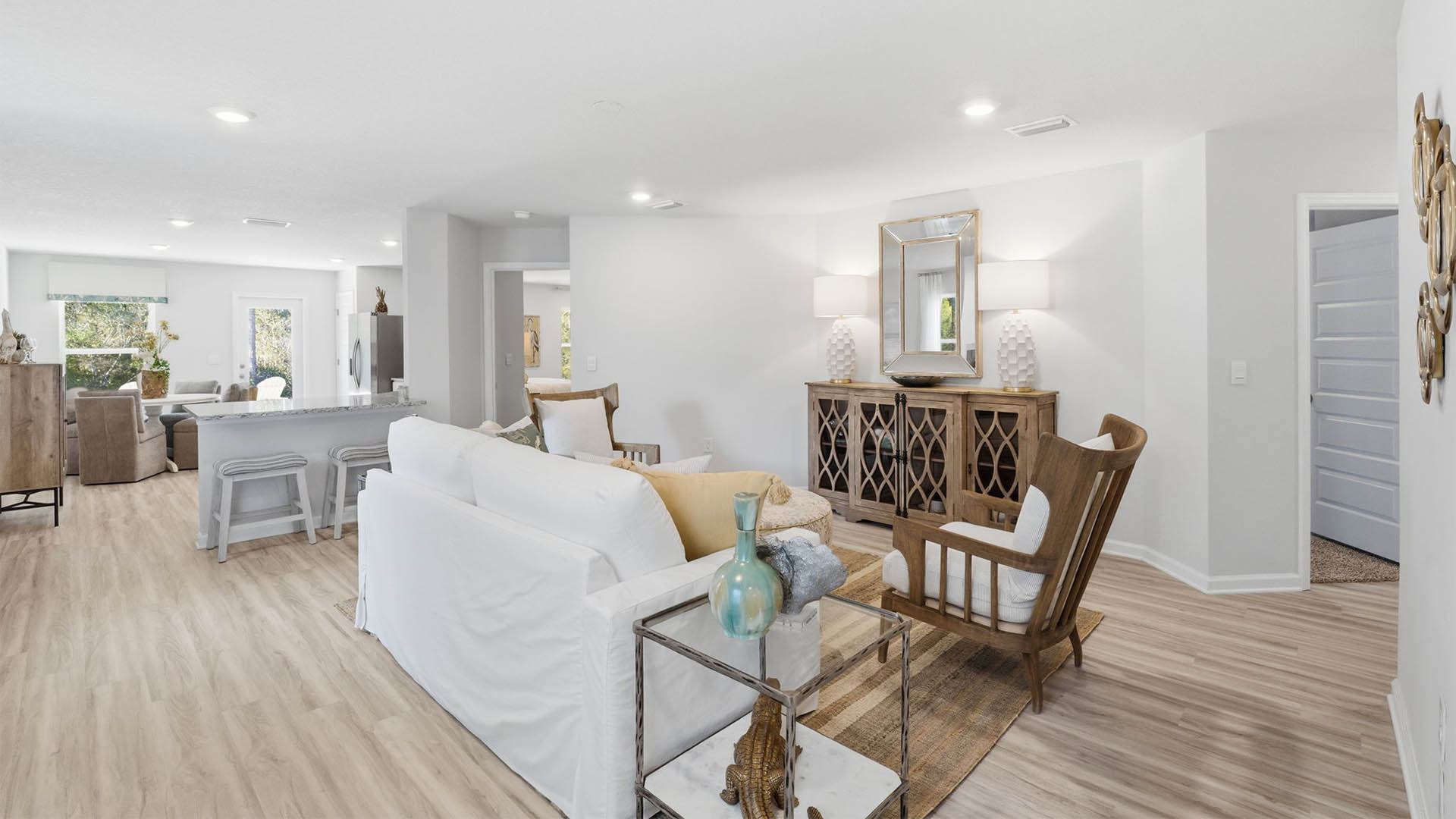 Living room with EVP flooring and kitchen and bedroom entrances.