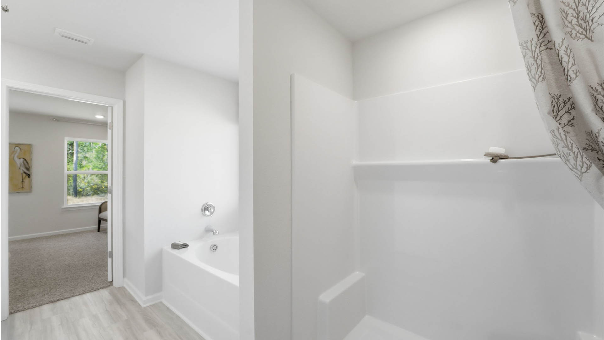 Primary bathroom separate tub and shower.