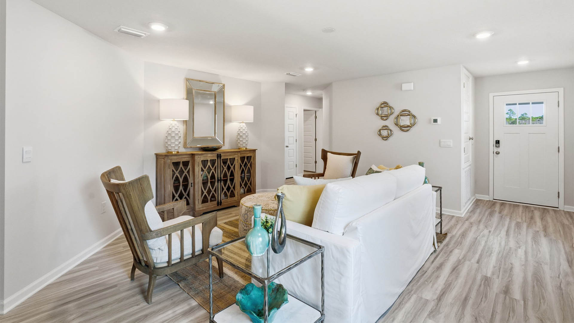 Living room and front door and hallway entrance.