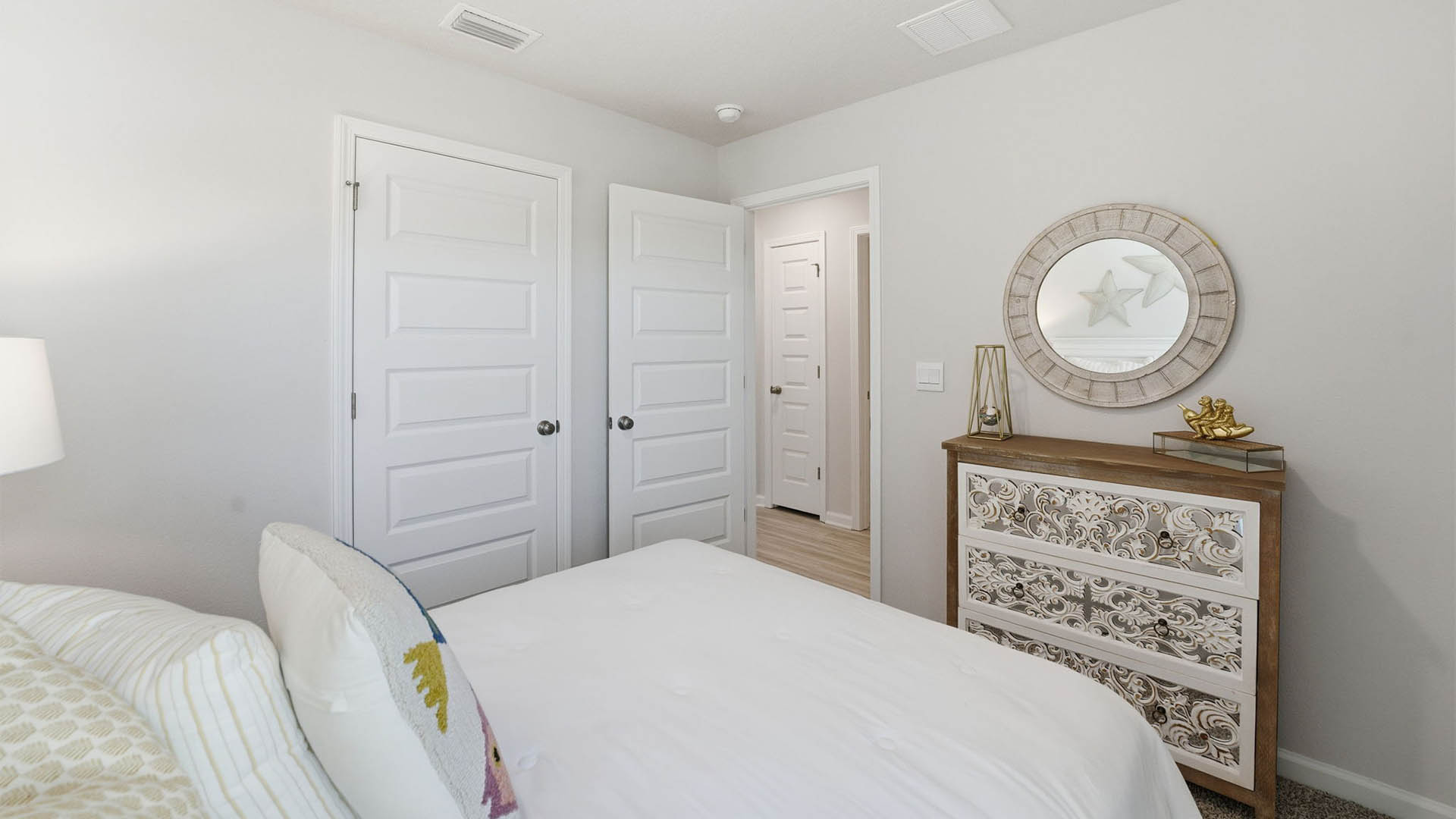 Bedroom with closet and carpet floors.