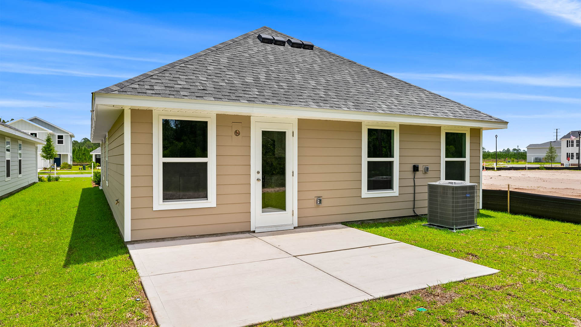 Celeste Plan rear of home with Hardie siding and concrete patio and back yard.