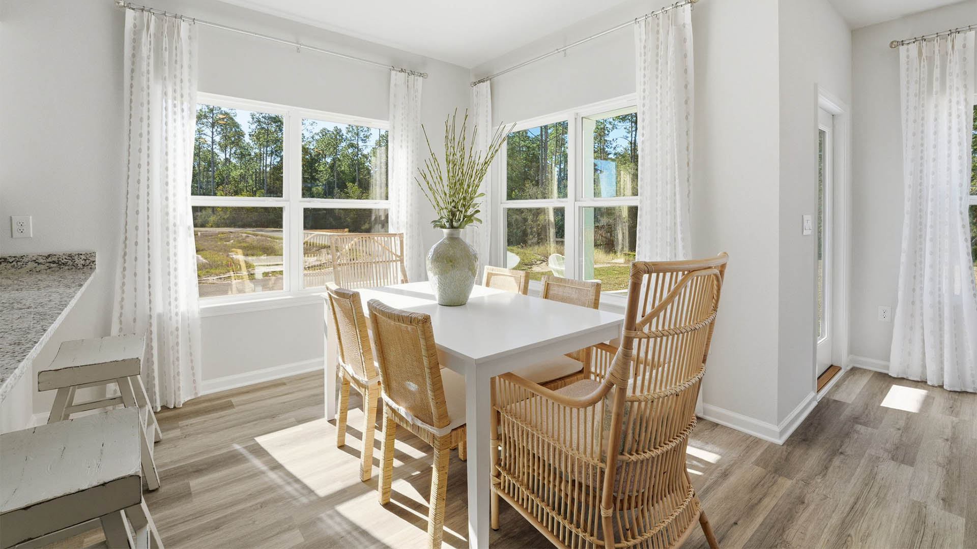 Dining area next to kitchen and back door.