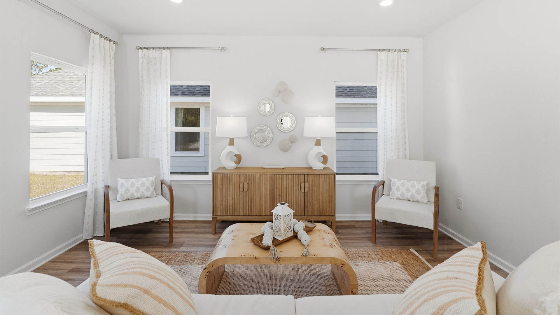 Living room with windows and EVP flooring.