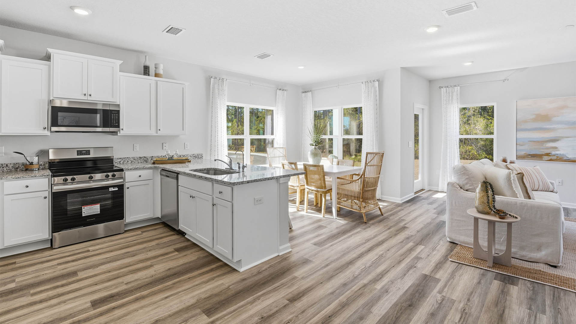 Open living room and kitchen with EVP flooring.