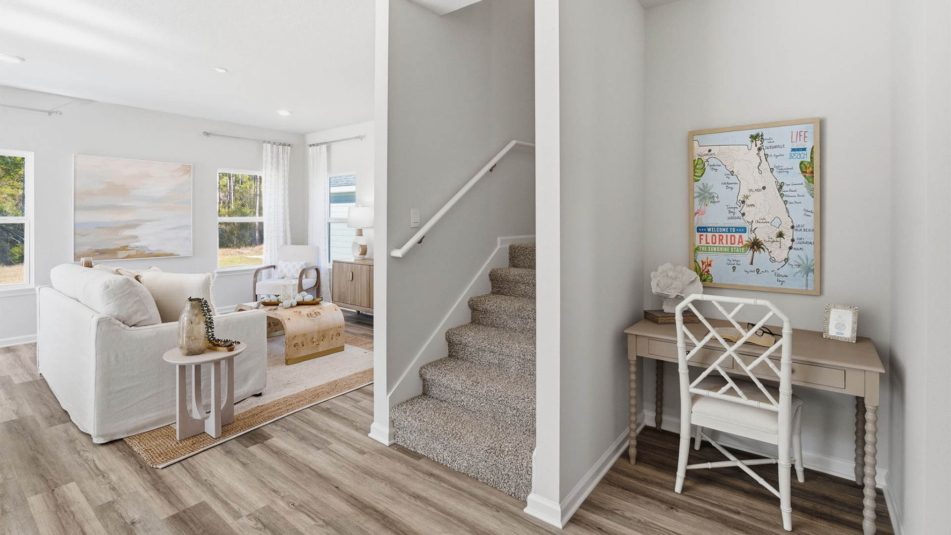 Foyer area next to carpeted stairs.