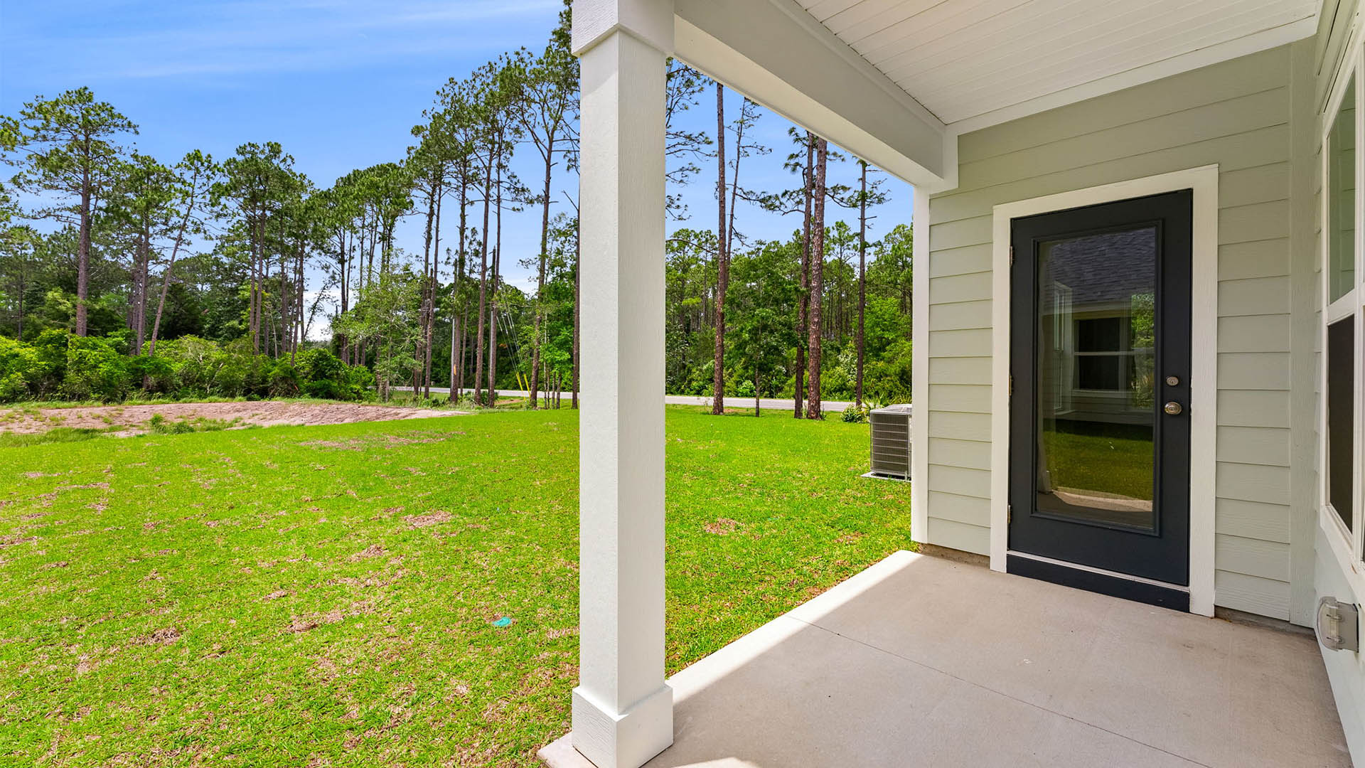 Covered rear patio view of back yard.