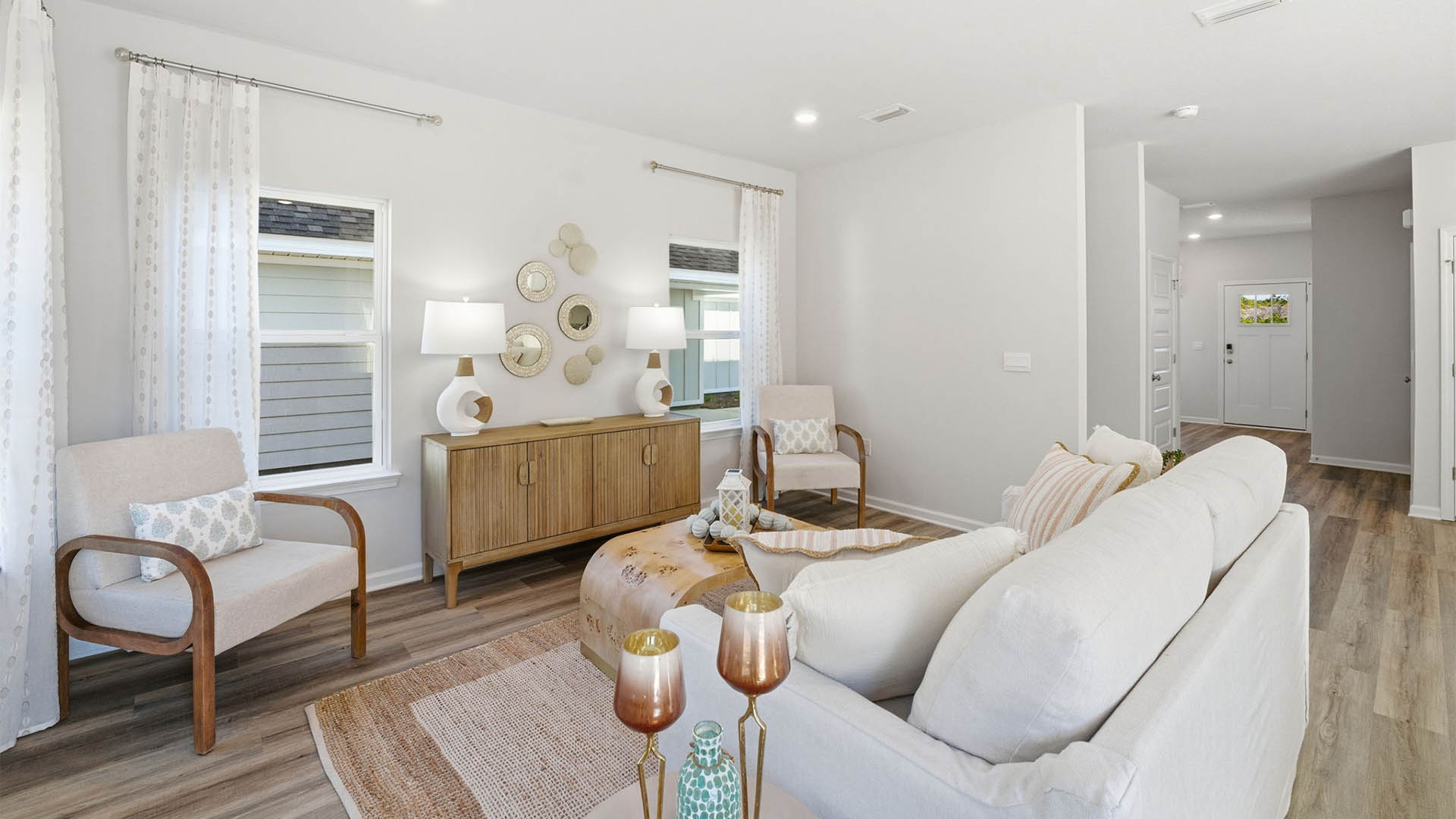 Living room with windows and EVP flooring.