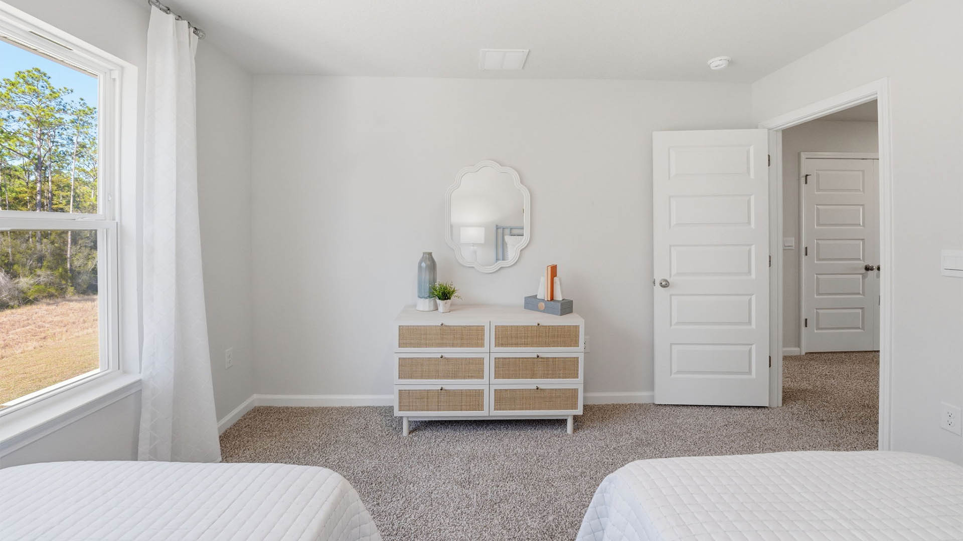 Bedroom with carpet floor and window.