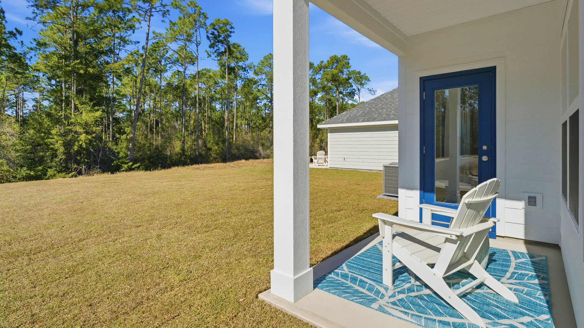 Back yard view and covered rear patio.