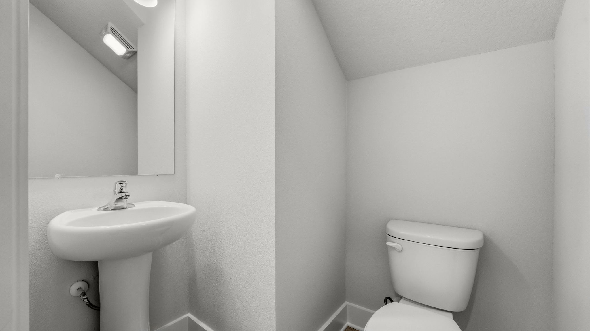 Front hallway with half bathroom.