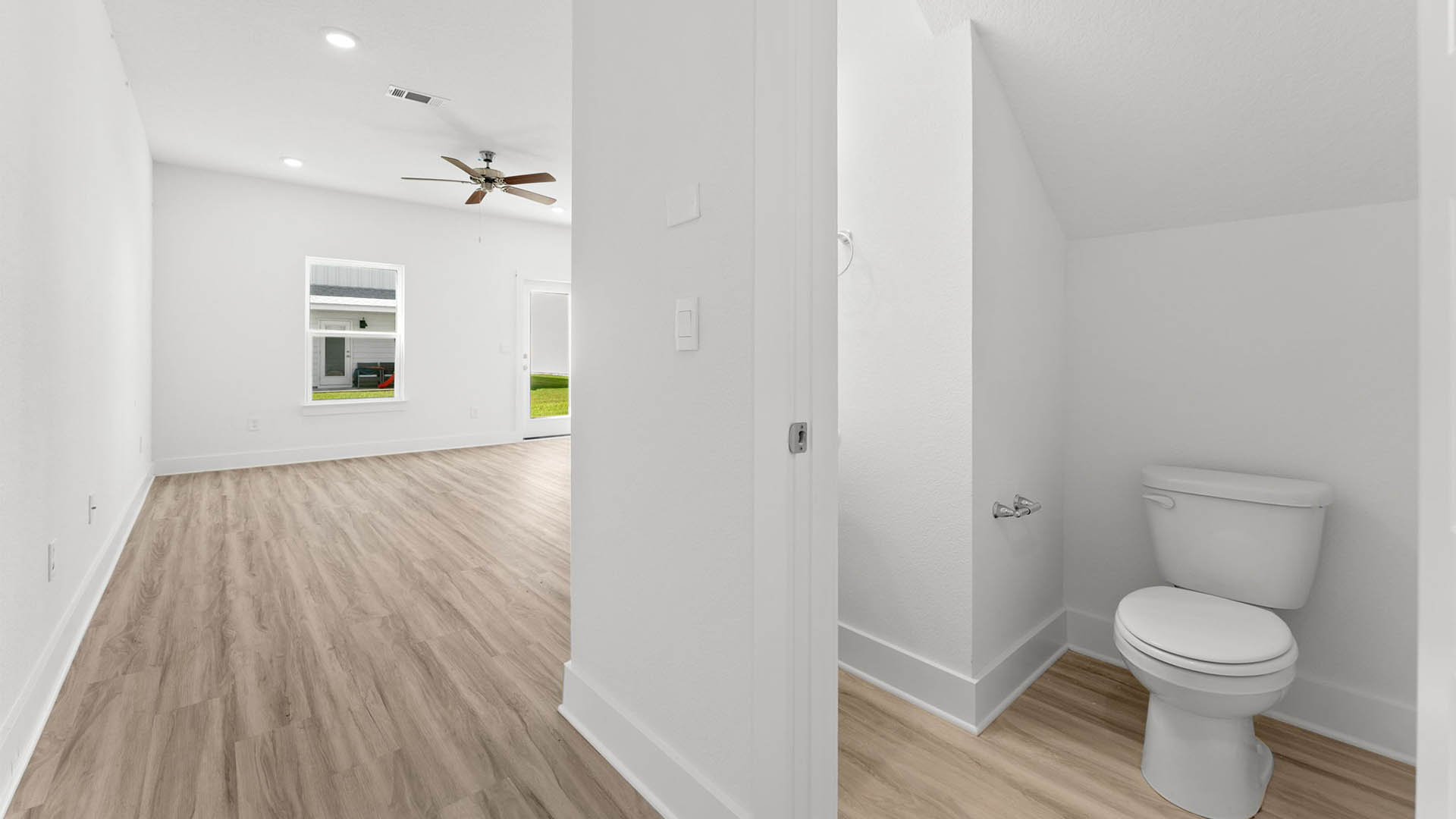 Front hallway with half bathroom.