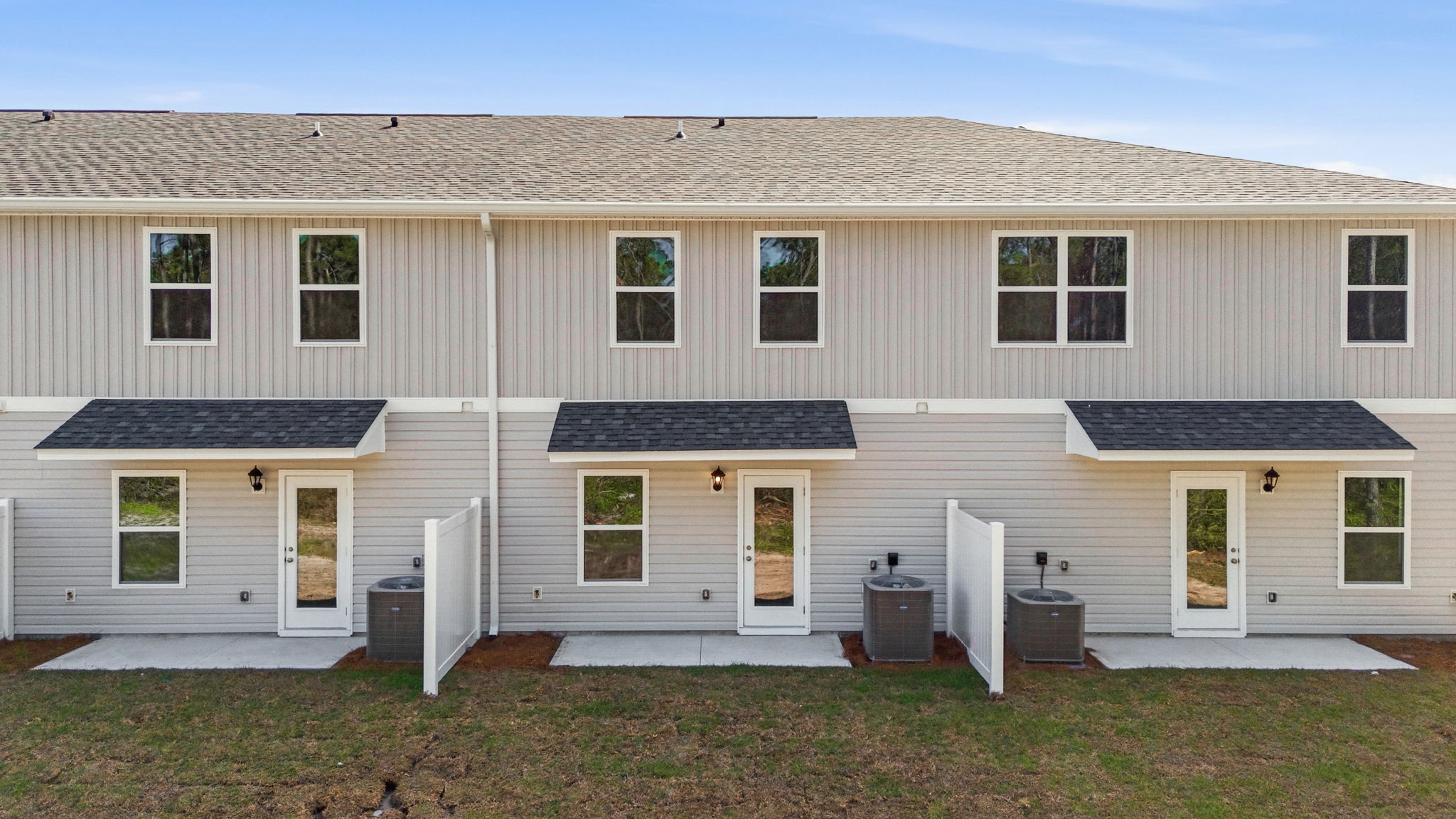 Covered back porch with air-conditioning unit.