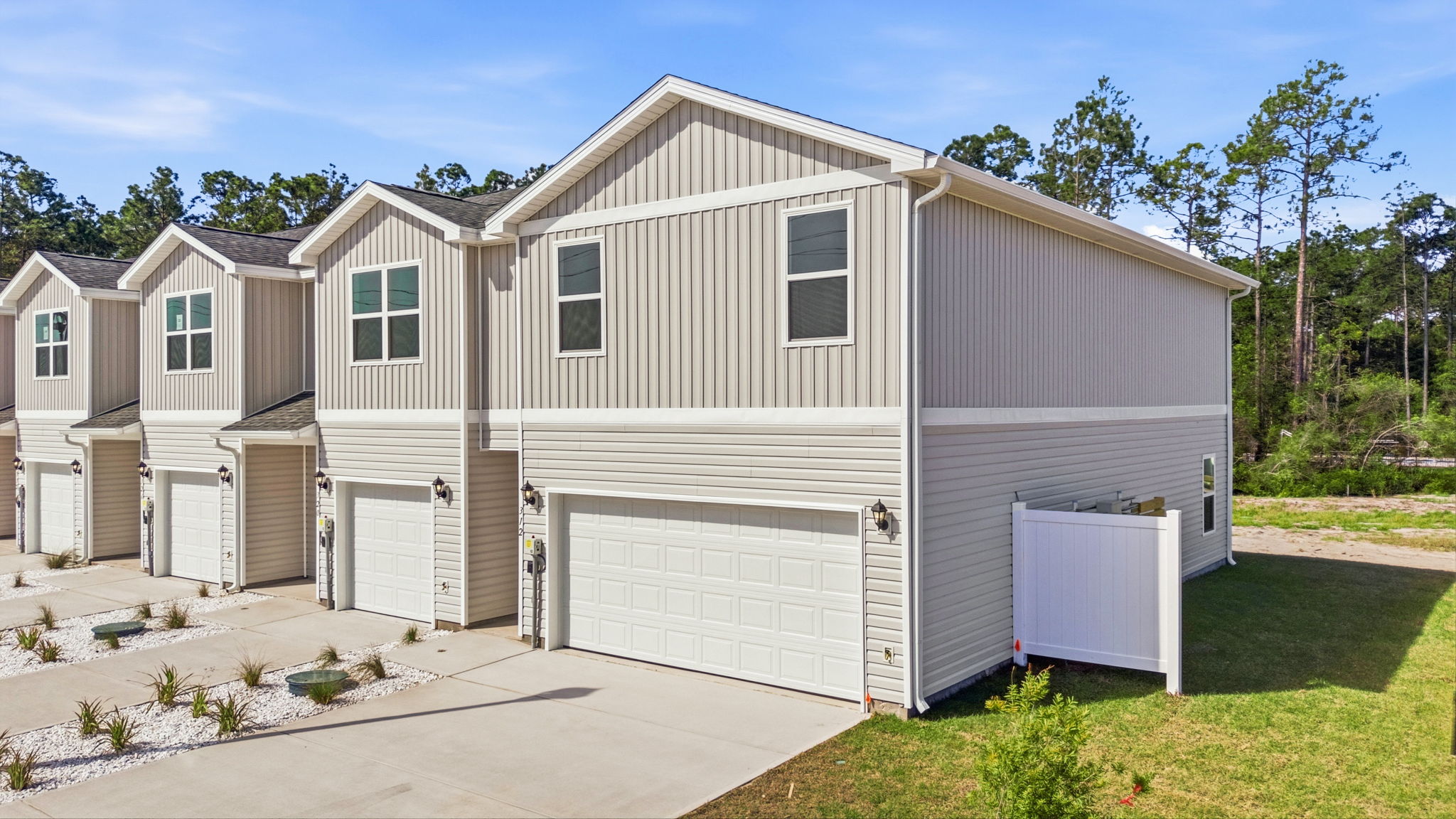 Two-story Sabal townhome with 2-car garage and vinyl siding.