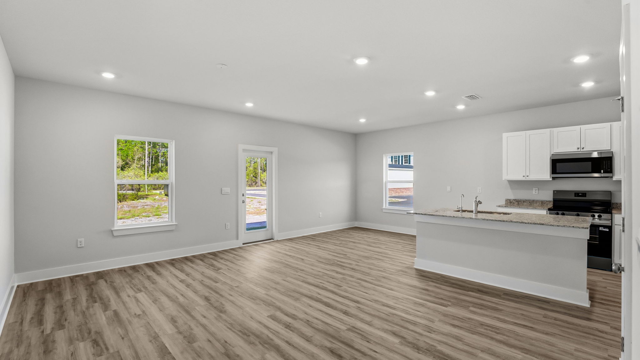 Open living room and kitchen with island.