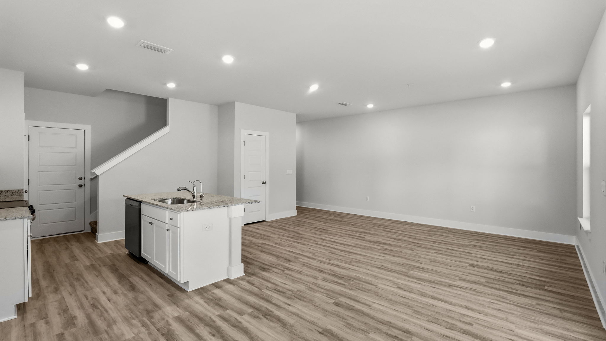 Open living room and kitchen with island.