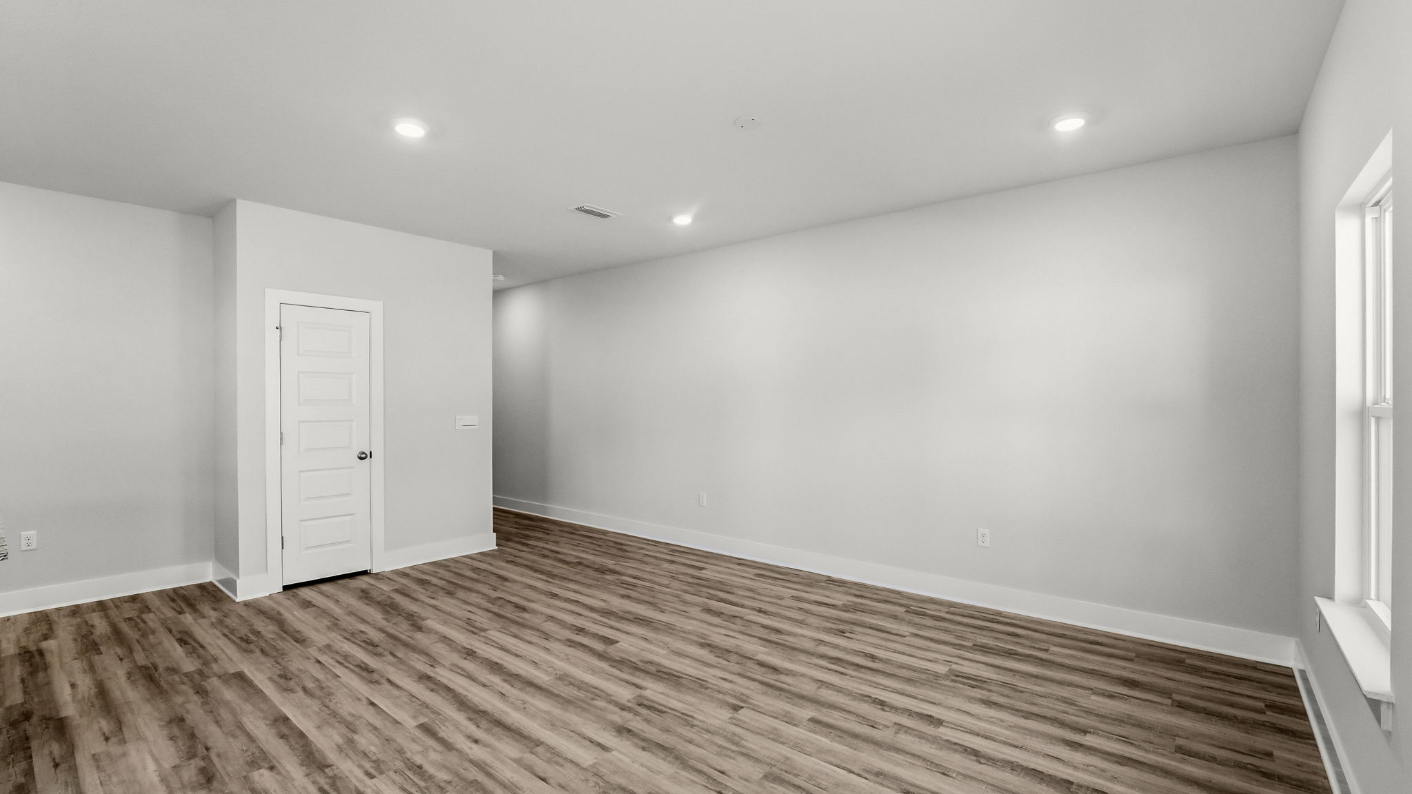Open living room with EVP flooring.