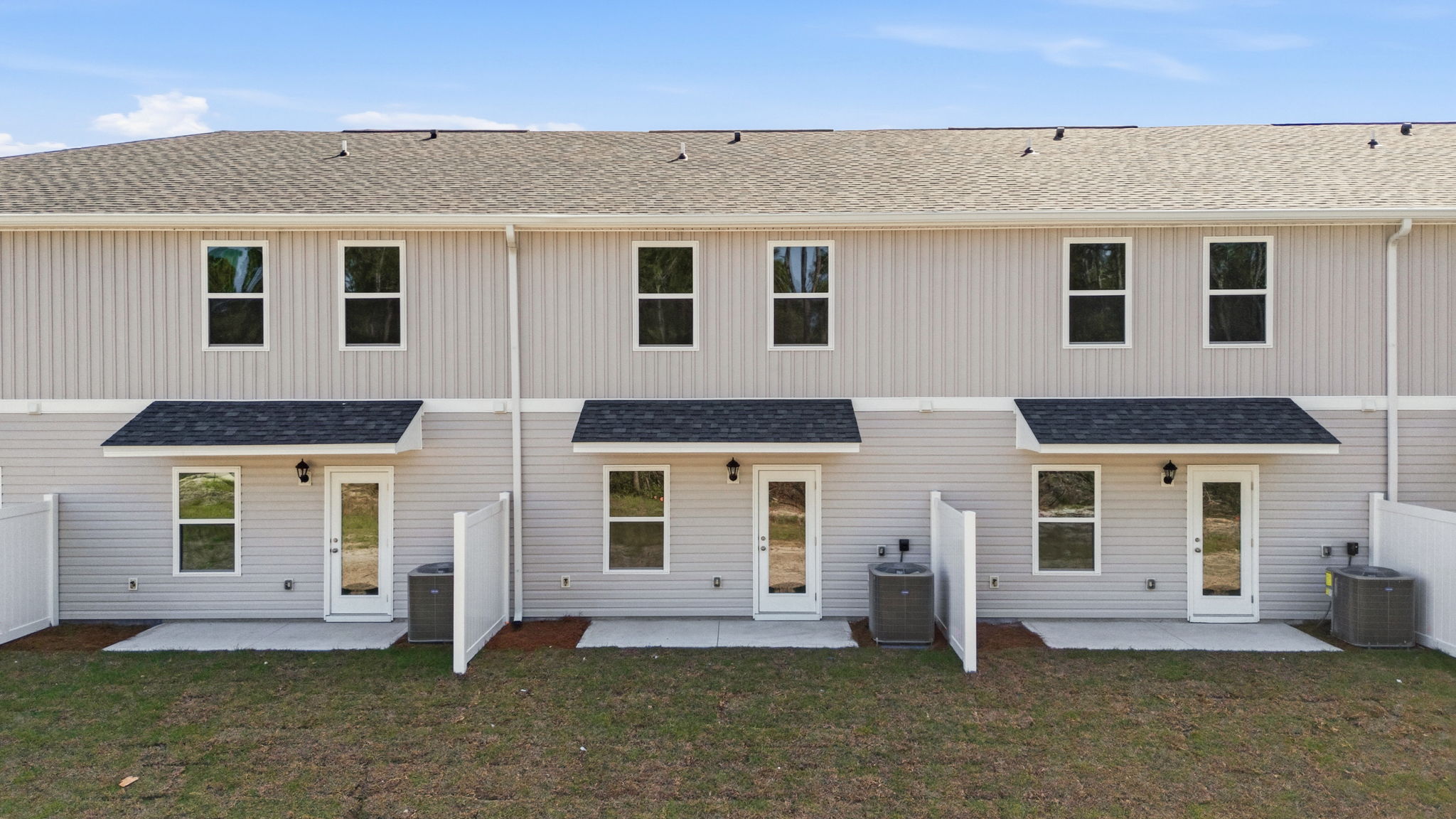 Covered back porch with air-conditioning unit.