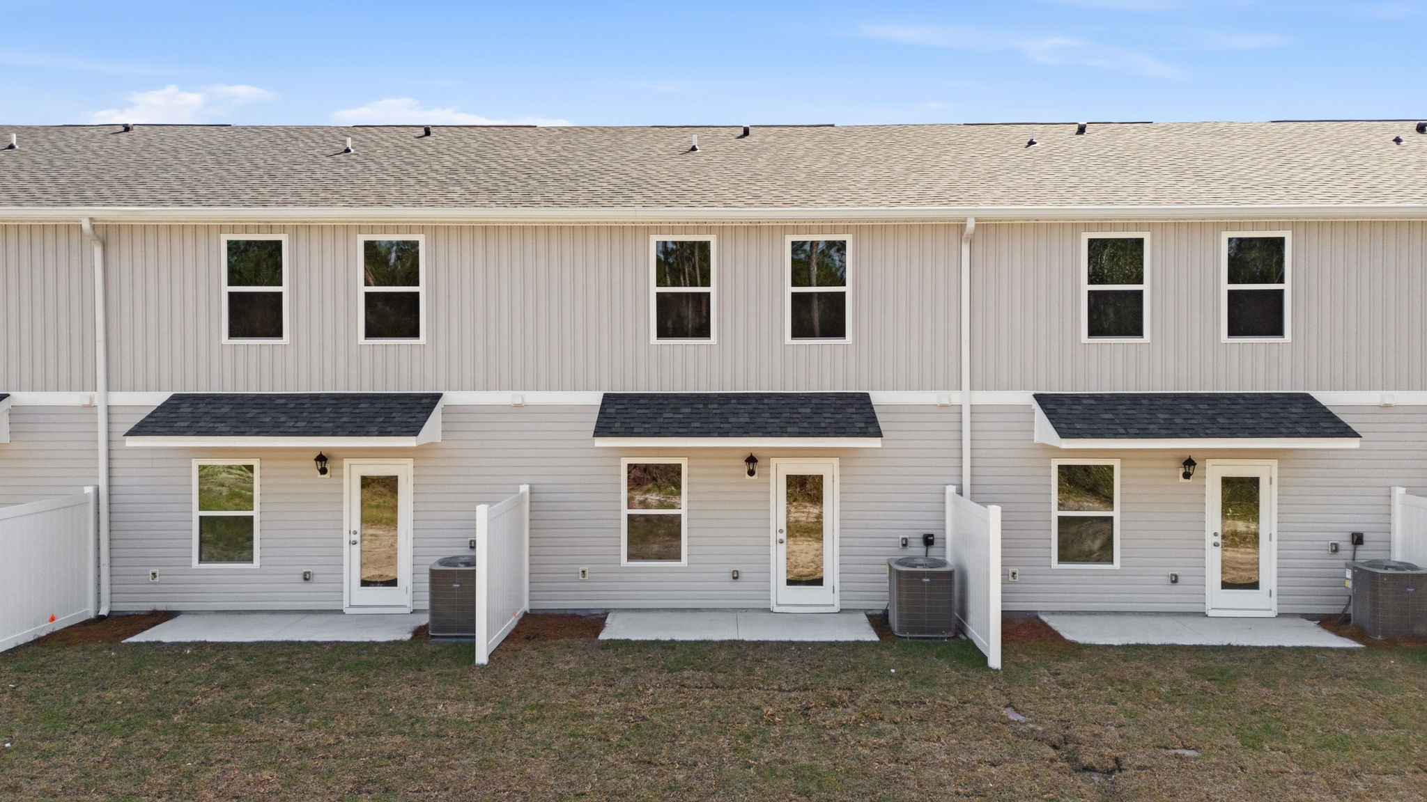Covered back porch with air-conditioning unit.