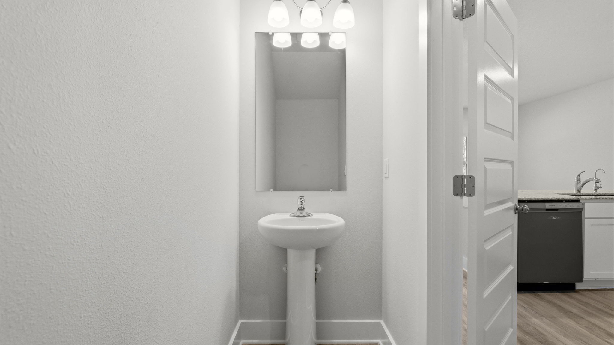 Front hallway with half bathroom.