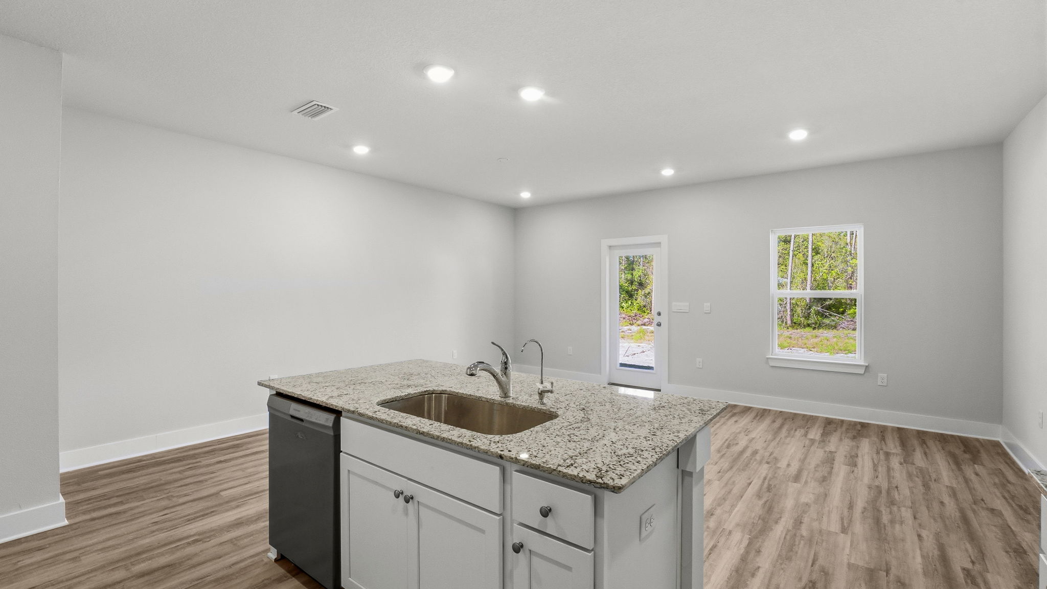 Open kitchen and living room view with island.