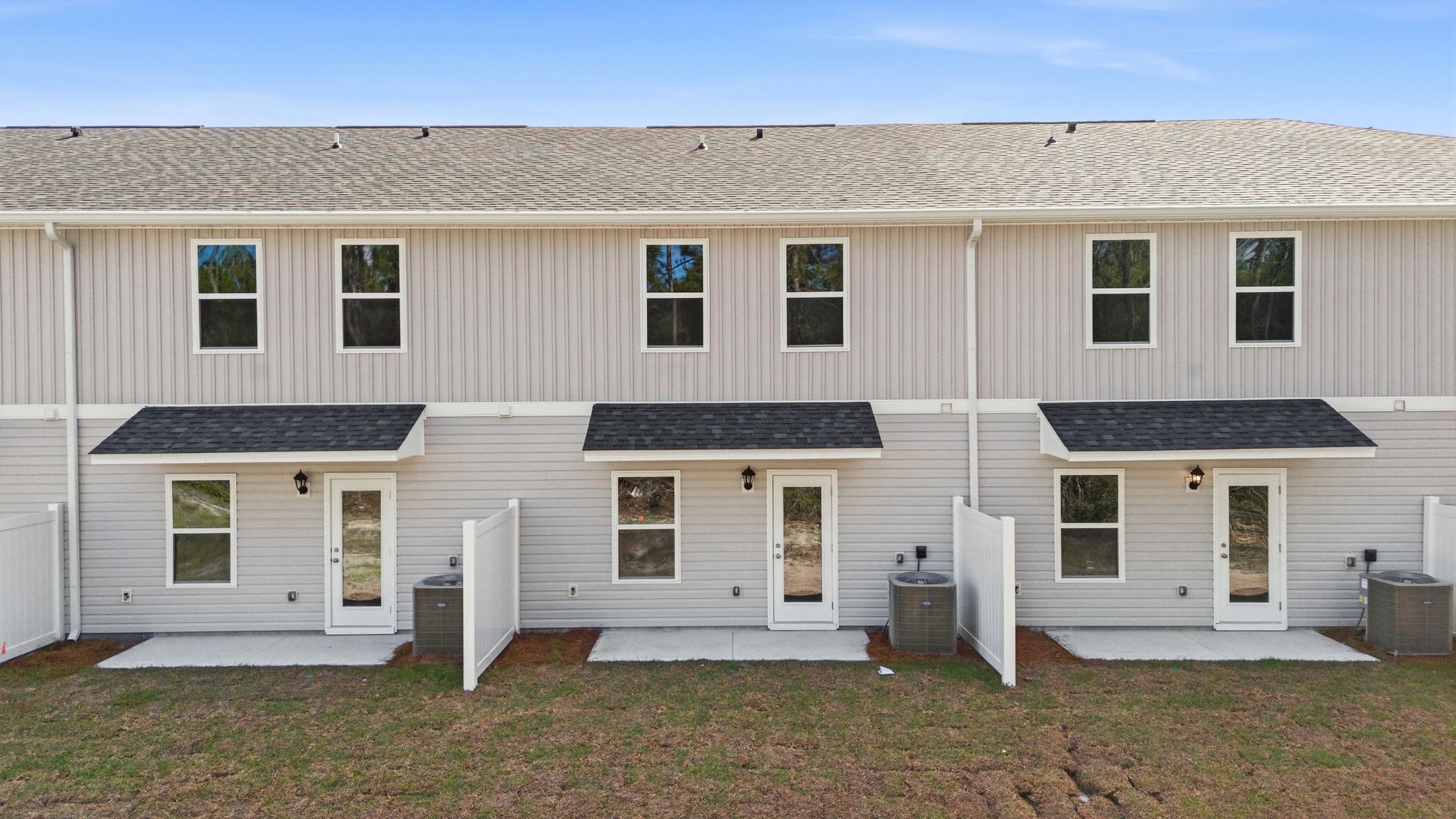 Covered back porch with air-conditioning unit.