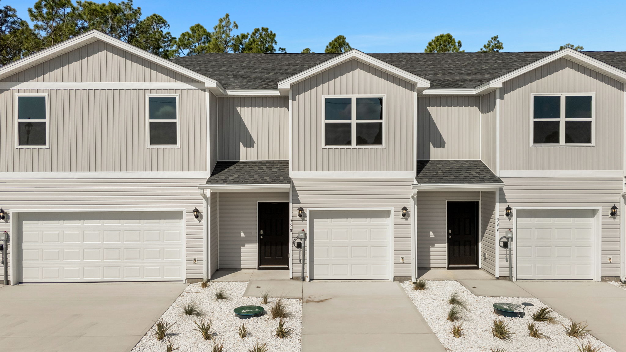 Sabal townhome with single car garage and vinyl siding.