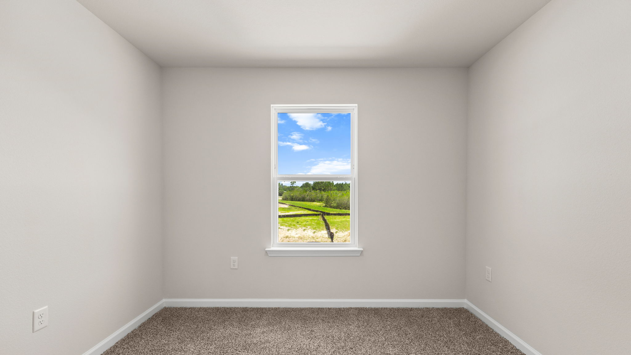 Bedroom with carpet floor and window.