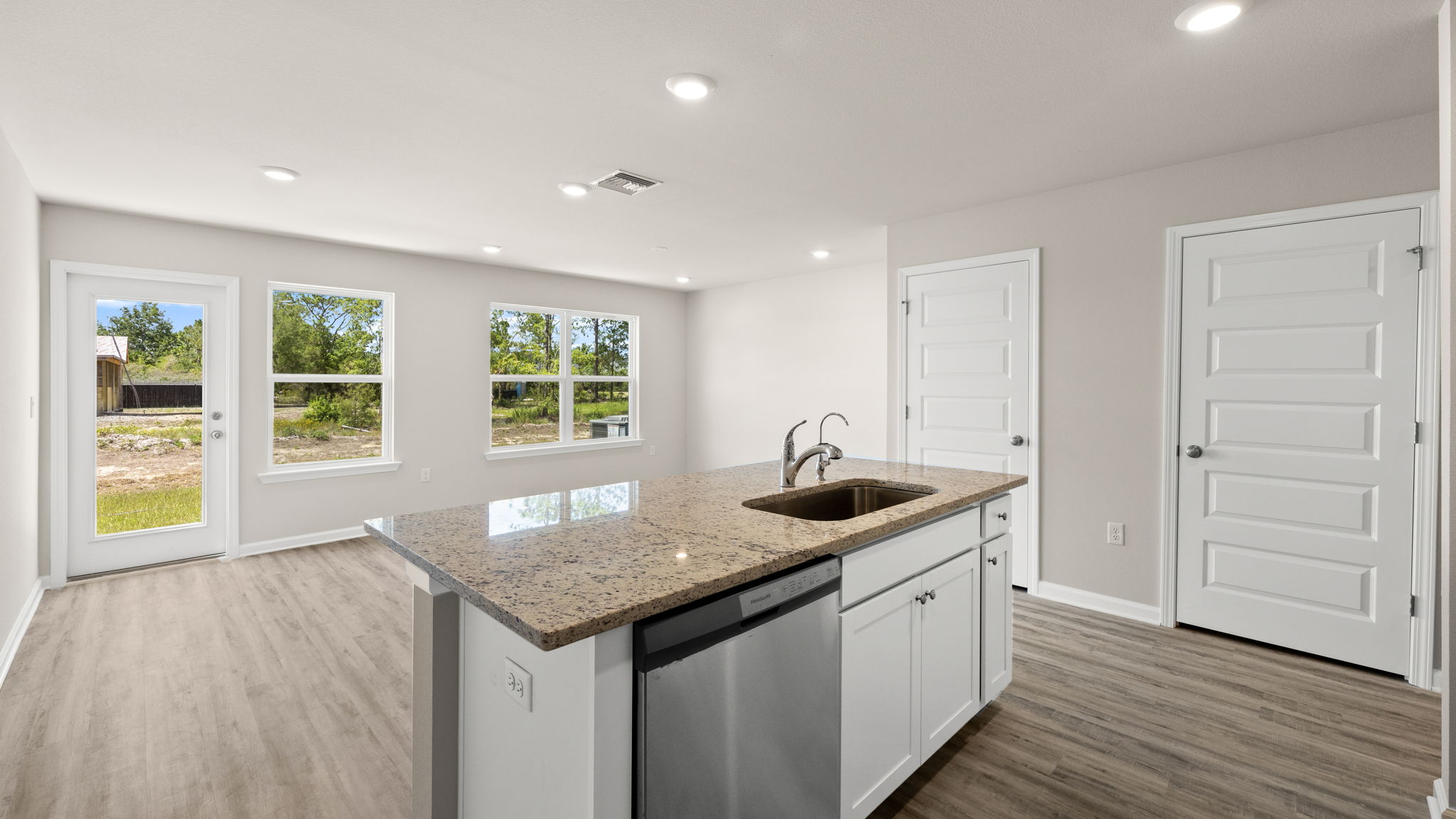 Kitchen with granite countertops and stainless-steel appliances.