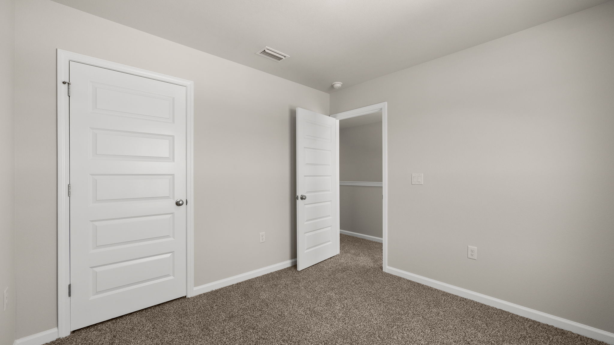 Bedroom with carpet floor and closet.