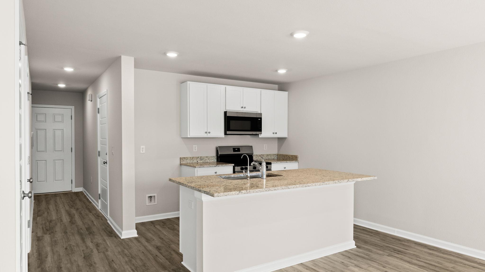 Kitchen with granite countertops and stainless-steel appliances.