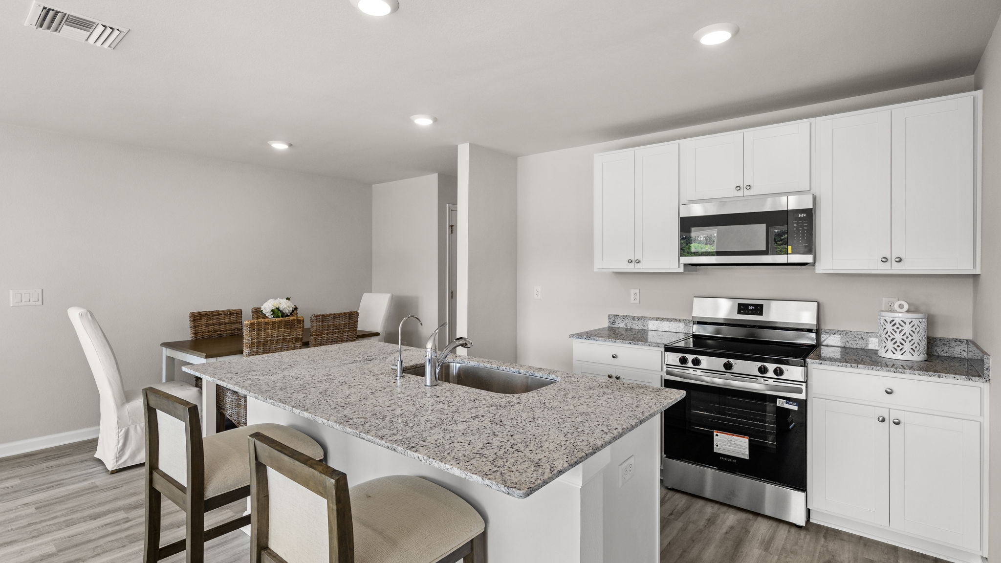 Kitchen with granite countertops and stainless-steel appliances.