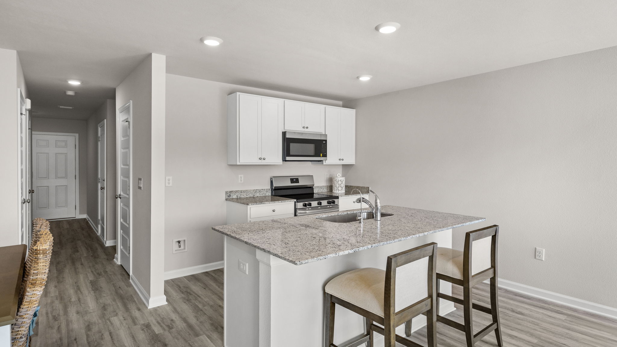 Kitchen with granite countertops and stainless-steel appliances.