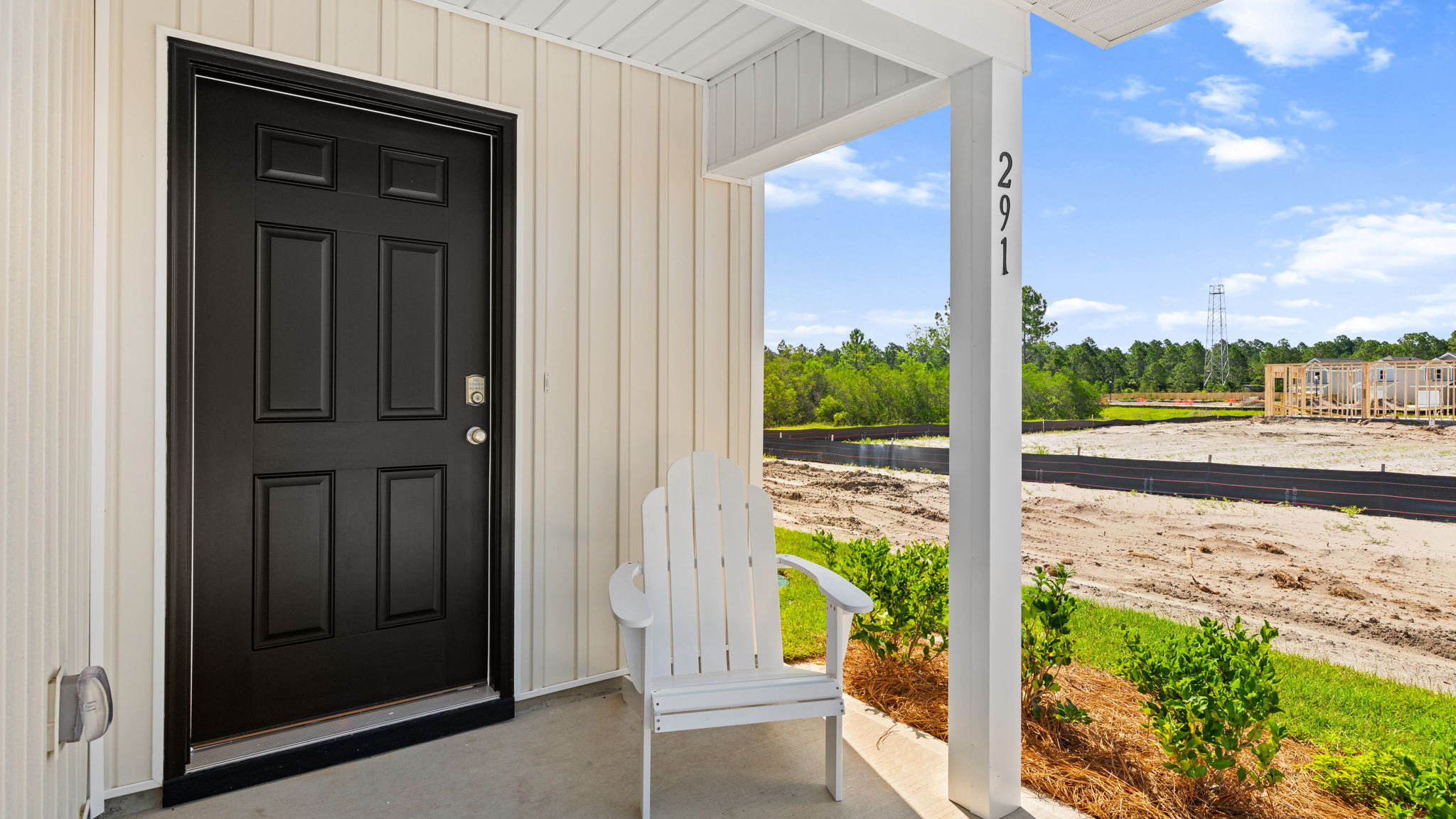 Covered front porch and front door.