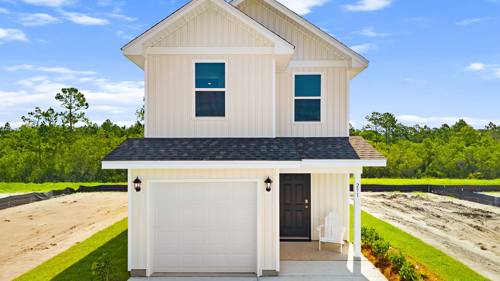 Bandon plan with vinyl siding and covered front porch.