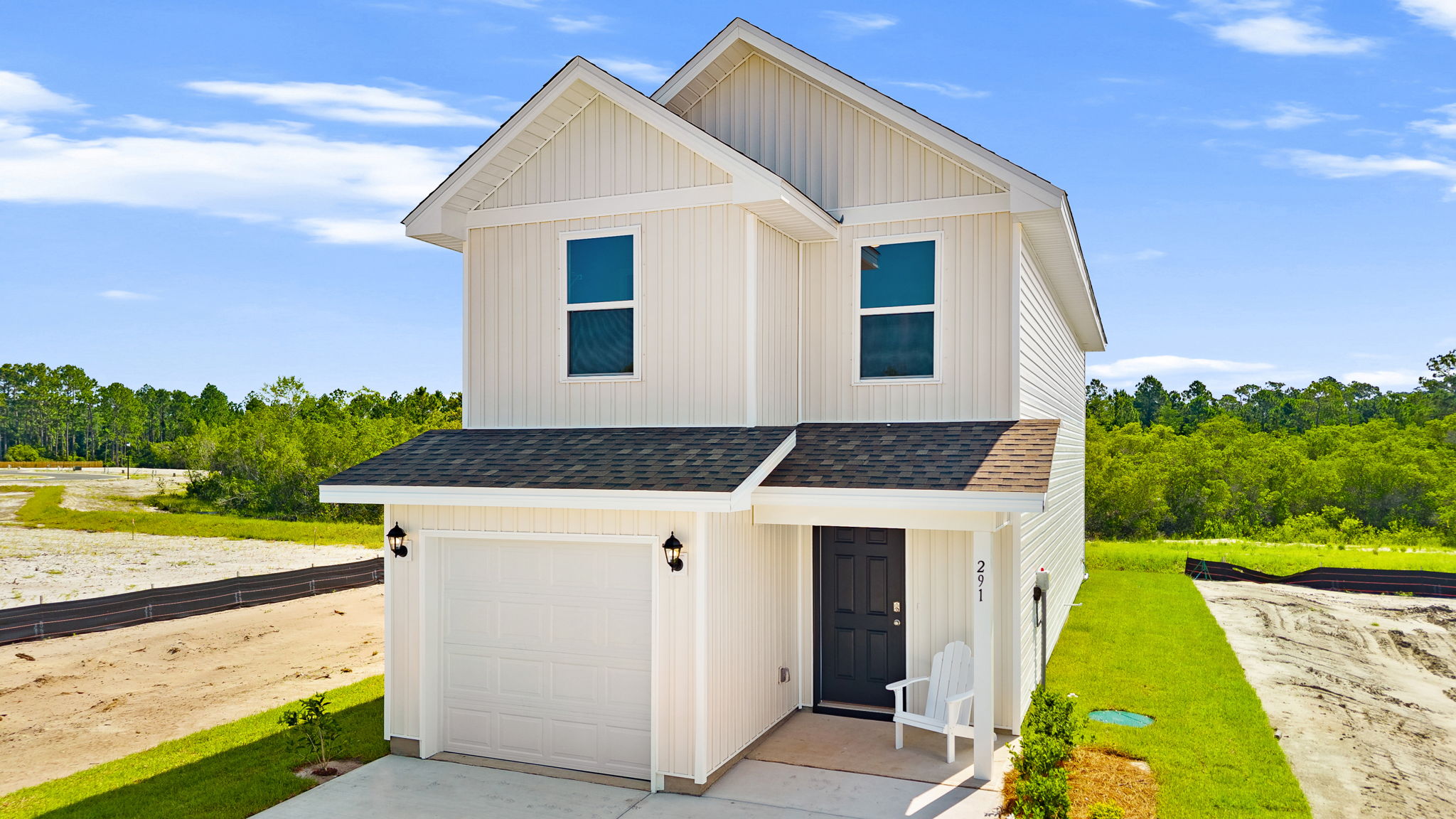 Bandon plan with vinyl siding and covered front porch.